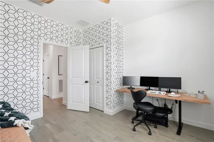 Office featuring light wood-style floors and baseboards