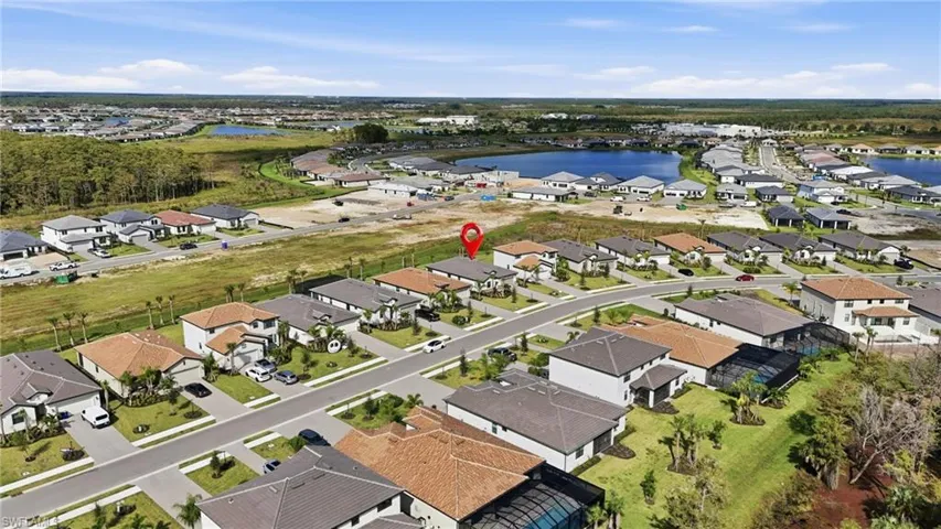 View of property location with a large body of water and nearby suburban area