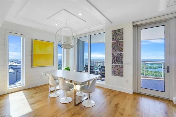 Dining area with light wood-style floors