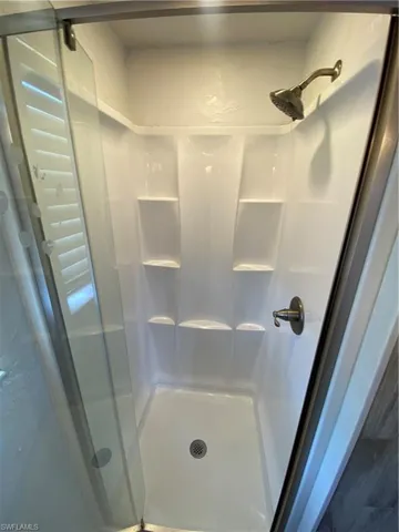 Bathroom with a shower with shower door