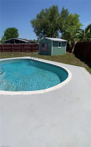 View of pool with an outdoor structure