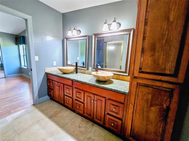 Bathroom featuring hardwood / wood-style floors and vanity