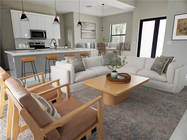 Living room featuring a raised ceiling