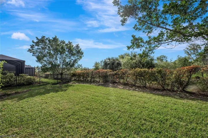 View of fenced backyard