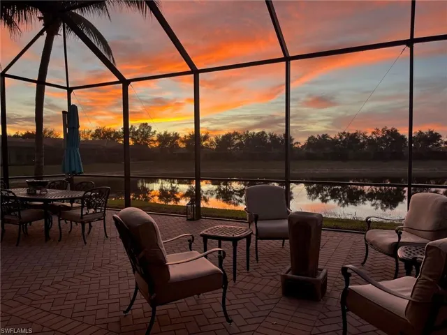 Lanai at sunset featuring a water view, too. Enjoy this daily!