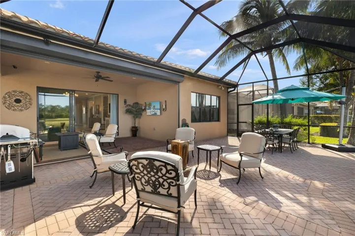 This just shy of 1000sf extended lanai boasts electric hurricane roll down shutters, electric water fountain feature, electric hook-up present for future outdoor kitchen, TV hook-up present, upgraded pavers in herringbone pattern, ceiling fan, fire pit area, and outdoor dining area all make for exceptional outdoor living opportunity!!!