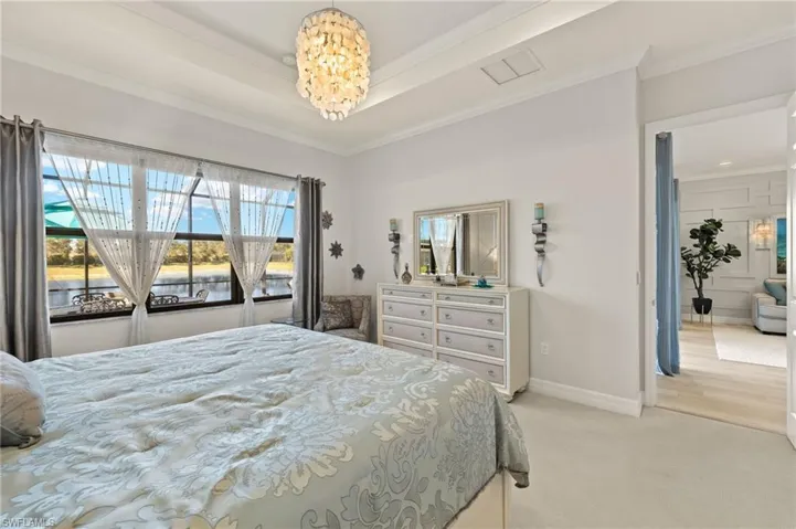 Furniture conveys! Tray ceiling and custom lighting! See the width of the extended nearly 1000 sqft lanai?