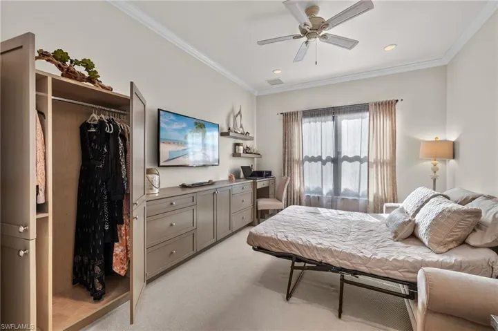 VOILA!!! Ingenious built-in armoire makes this multi-purpose room invaluable and hides away your guests belongings! LOVE< LOVE< LOVE! Pocket doors allows your guests privacy, too!