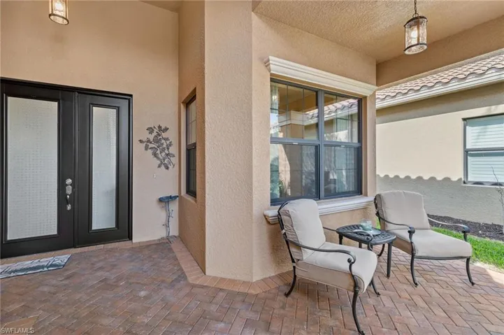 Double door entry makes for a grand entry into this fabulous home! Walkway to front door was widened! Impact resistant doors and windows throughout the home!!
