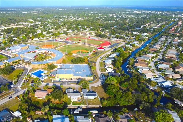 View of property location with nearby suburban area