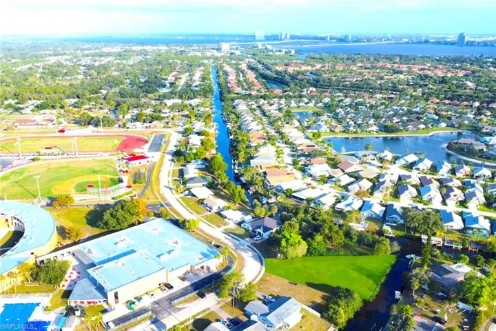 Aerial overview of property's location with nearby suburban area