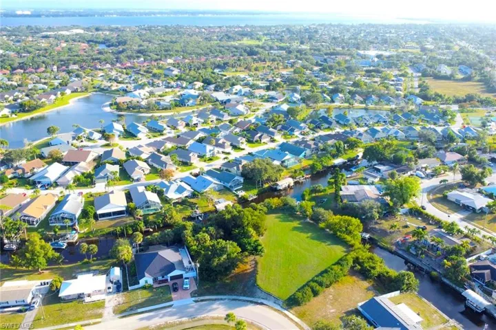 View of property location featuring nearby suburban area and a large body of water