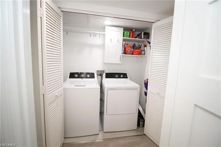 Laundry room featuring independent washer and dryer