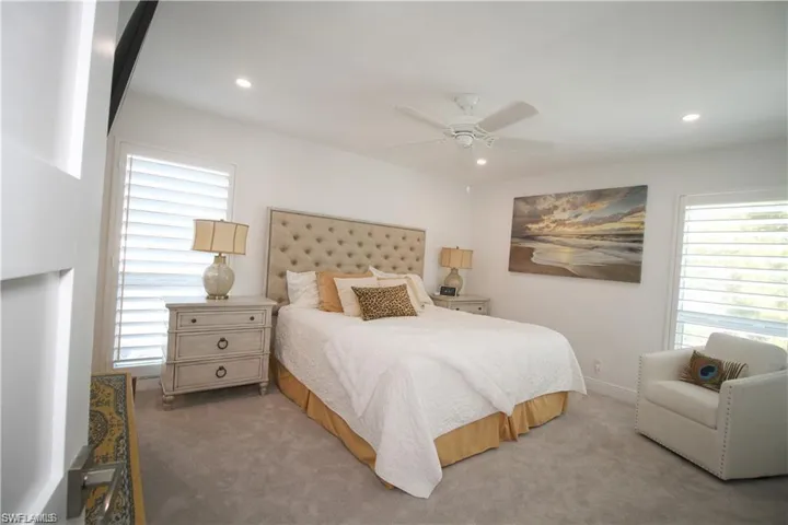 Bedroom featuring ceiling fan, carpet flooring, and recessed lighting