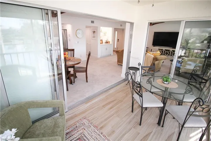 Dining room featuring light carpet and light wood-style flooring