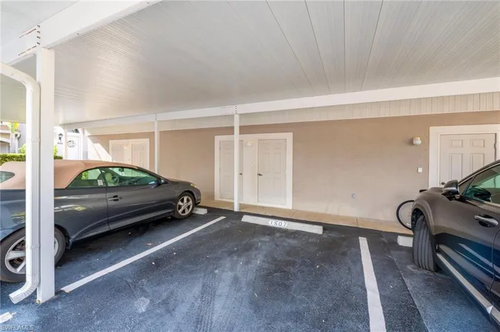 Garage featuring covered parking