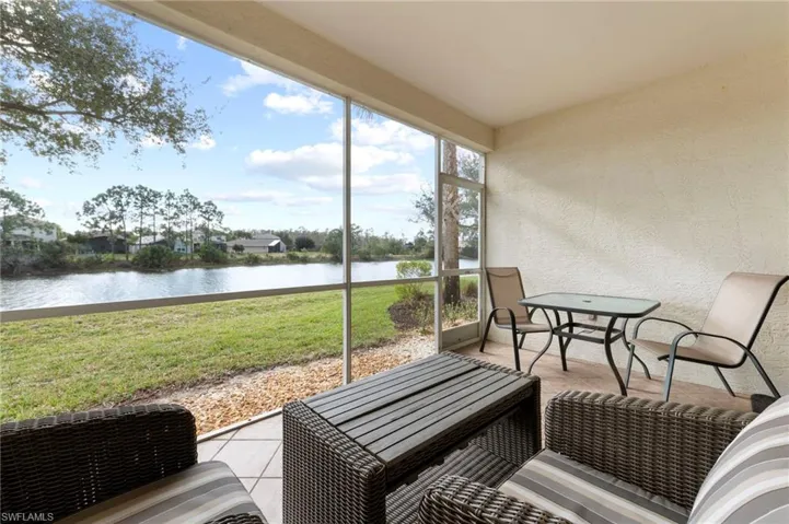 Sunroom with a water view