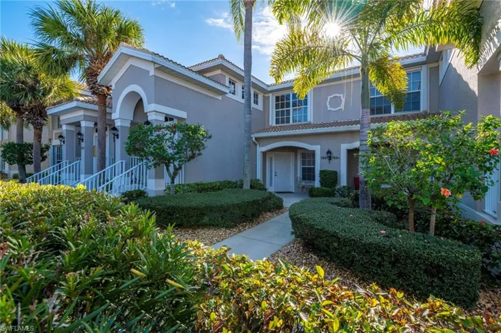 Mediterranean / spanish-style home featuring a tiled roof and stucco siding