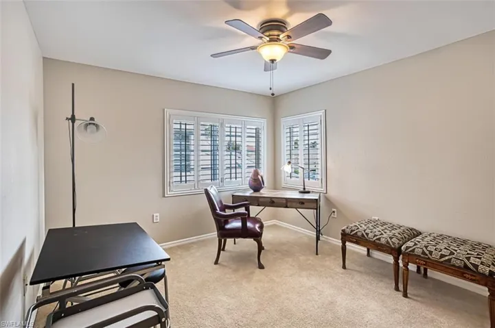 Guest bedroom featuring an inviting chandelier