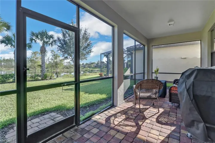 Sunroom with a water view