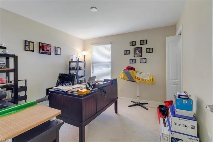 Office featuring light colored carpet