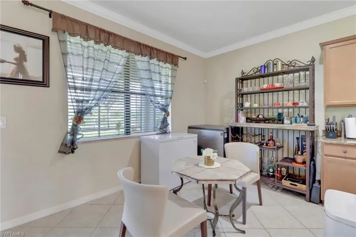 Tiled dining room with ornamental molding