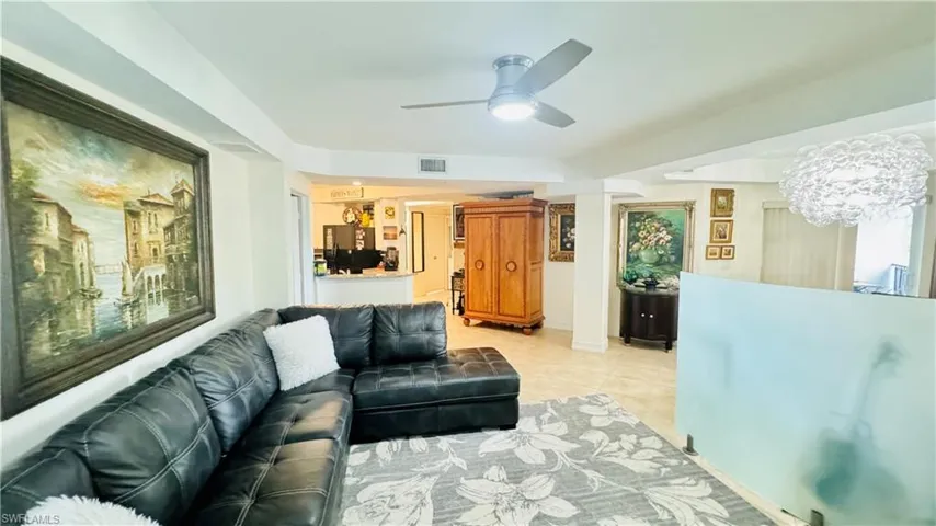 Tiled living room with ceiling fan