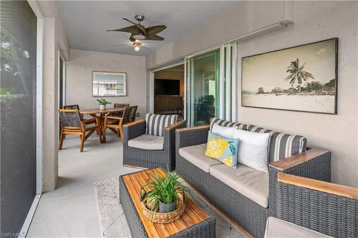 Sunroom / solarium with an outdoor living space, a ceiling fan, and outdoor dining space