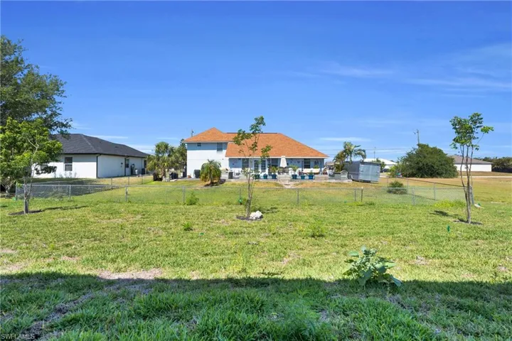 View of yard featuring fence