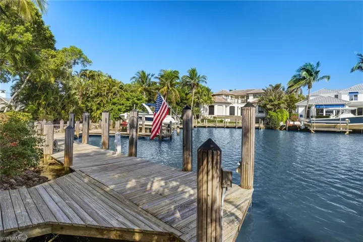 View of dock with a water view and a residential view