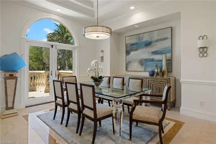 Dining room featuring baseboards, ornamental molding, french doors, and recessed lighting