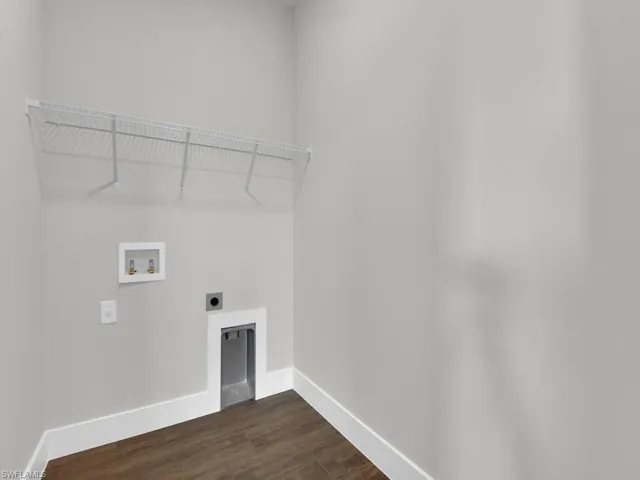 Laundry room with electric dryer hookup, dark wood-style floors, and washer hookup