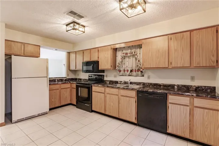 2406  Queen  DR, Lehigh Acres, FL 33971