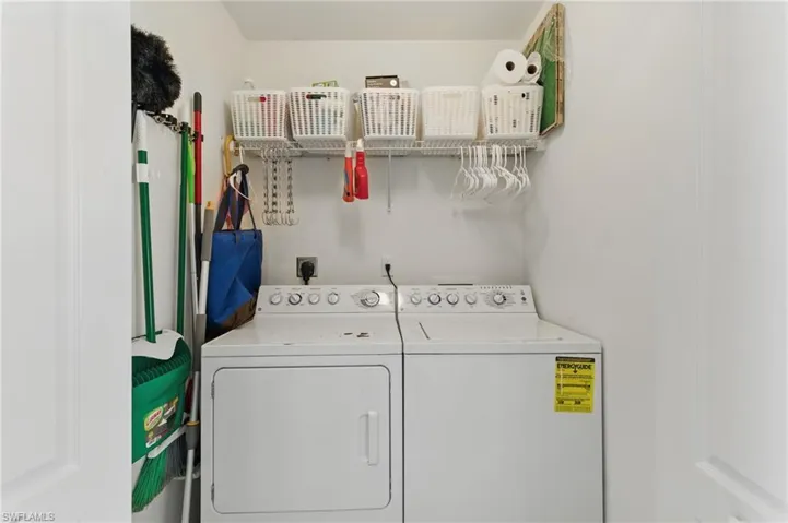 Laundry room featuring washer and dryer and laundry area