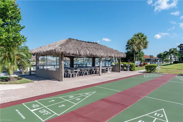 View of home's community with shuffleboard and a gazebo