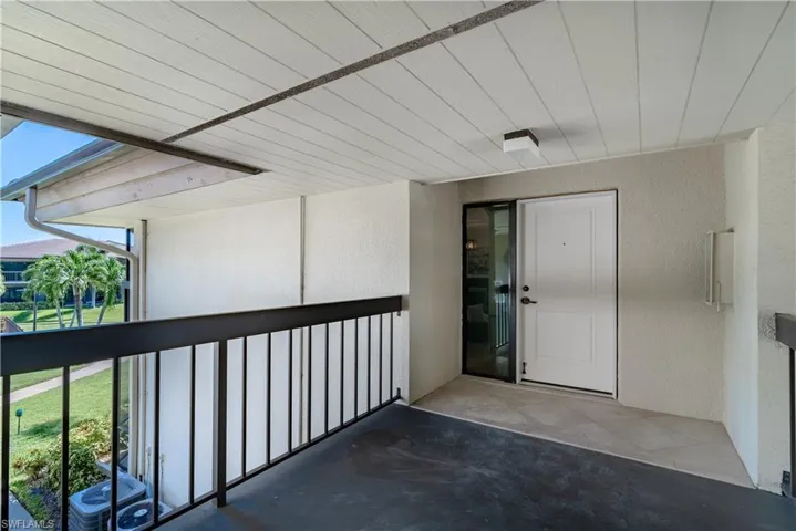 Property entrance with stucco siding
