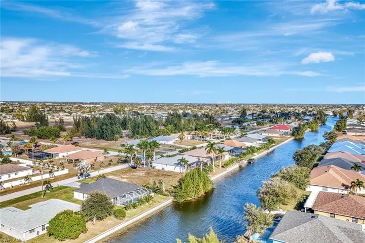 Aerial view of residential area featuring a large body of water