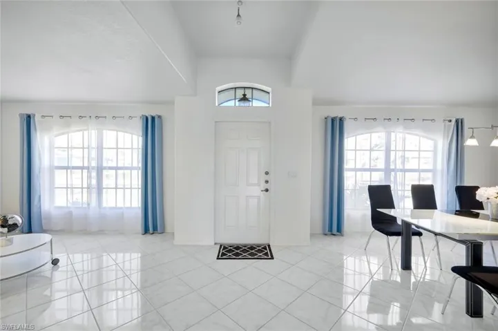 Entryway featuring light tile patterned floors