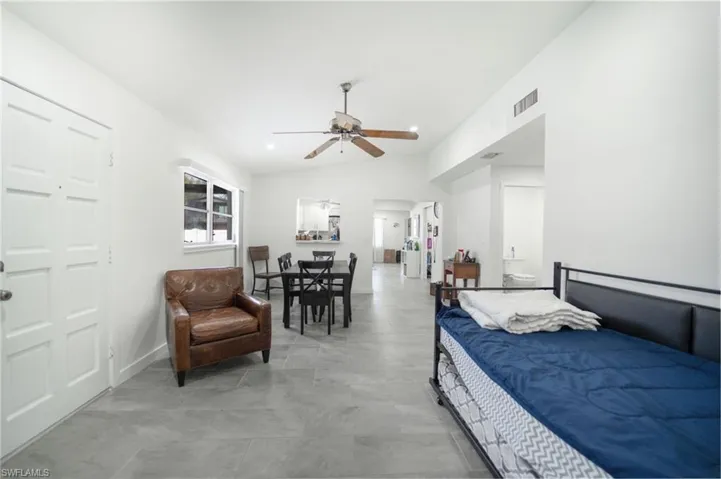 Bedroom featuring vaulted ceiling and ceiling fan