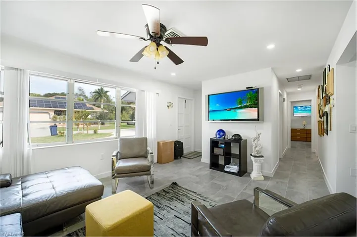 Living room featuring ceiling fan
