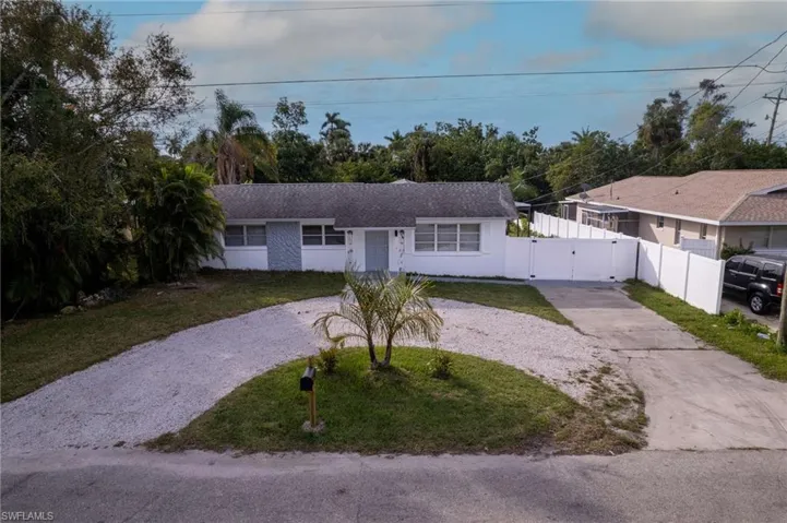 Single story home with a front yard