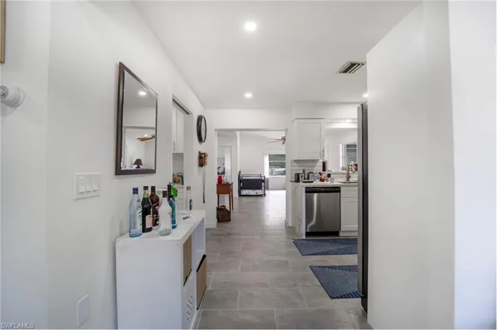 Hallway featuring sink
