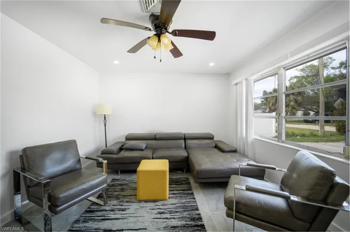 Living room featuring ceiling fan