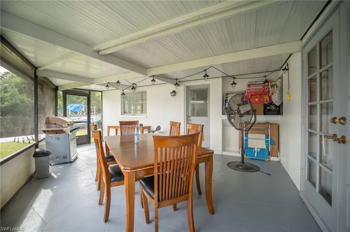 Sunroom / solarium with plenty of natural light and beam ceiling