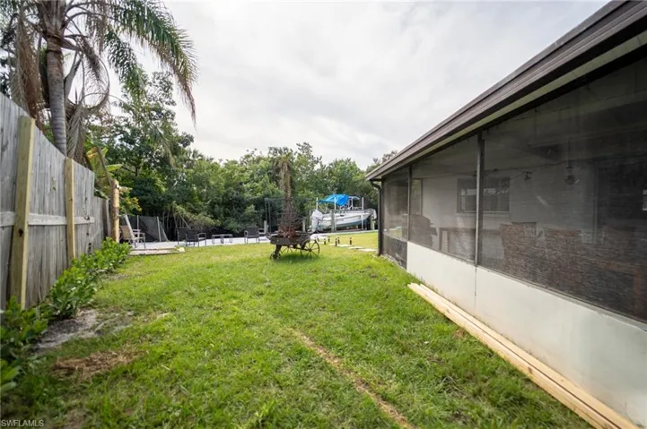 View of yard with a sunroom