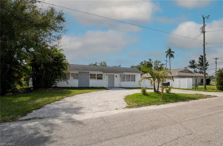 Ranch-style home with a front yard