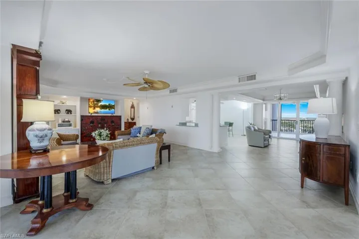 LIVINGROOM LOOKING TO OPEN KITCHEN AND SUNRISE LANAI