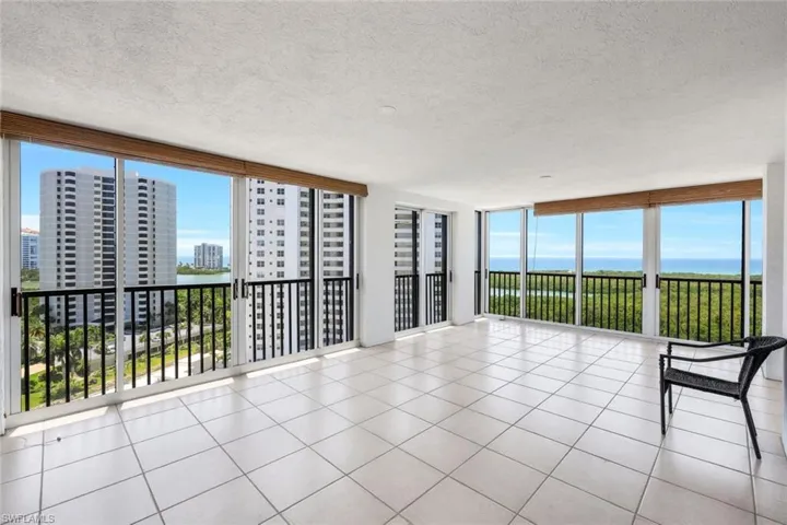 END UNIT LANI WITH VIEWS OF PARKSHORE LIGHTS AND BRILLIANT SUNSETS OVER THE GULF OF MEXICO