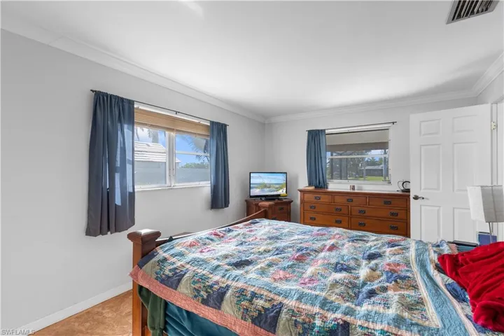 Bedroom featuring ornamental molding