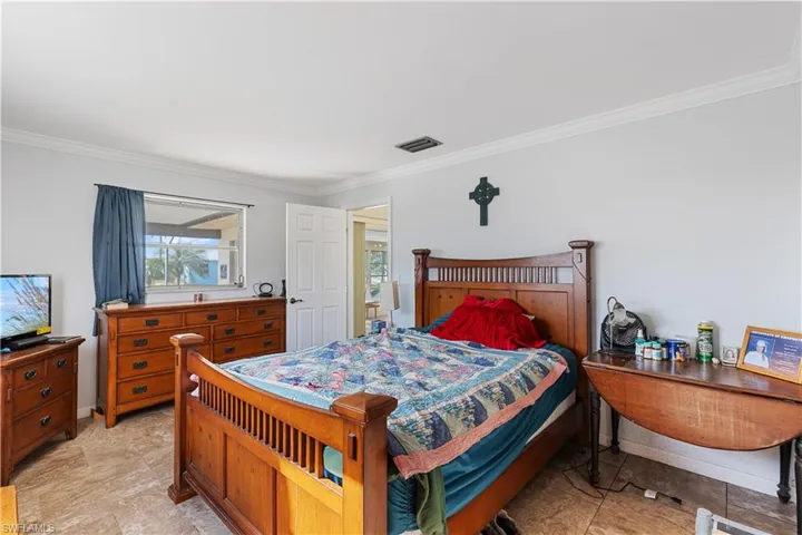 Bedroom featuring crown molding